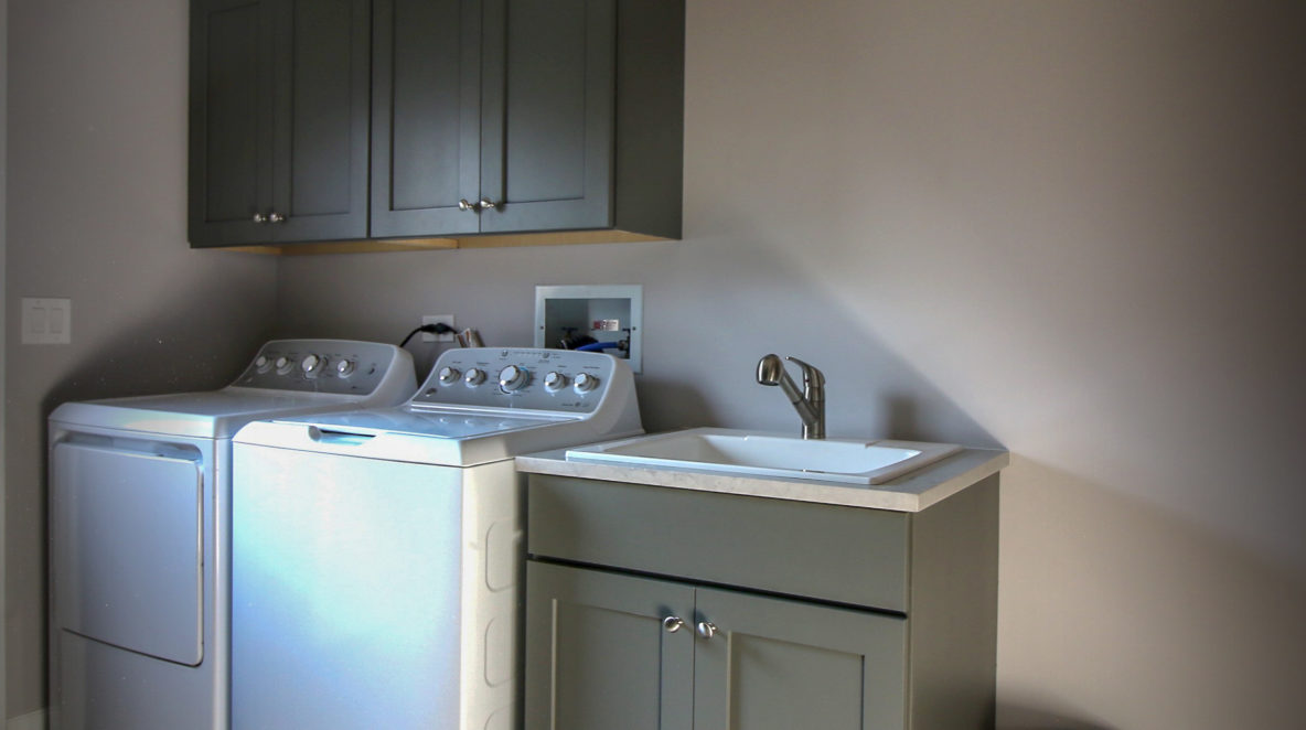 Laundry Room with Cabinetry and Slate Floor