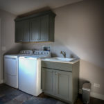 Laundry Room with Cabinetry and Slate Floor