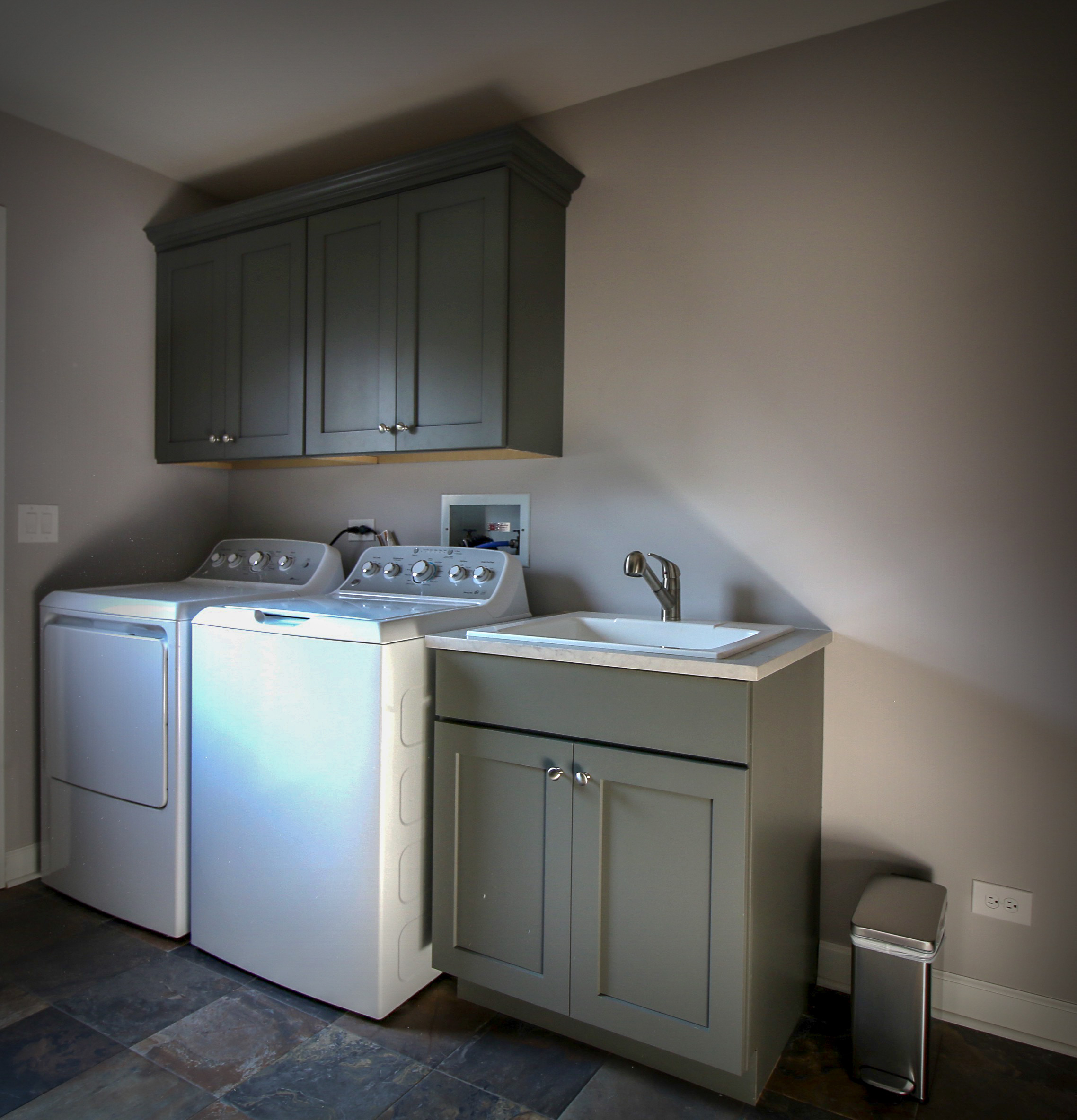 Laundry Room with Cabinetry and Slate Floor