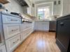 Brushed Gold Cabinet Hardware with Crisp White Cabinetry