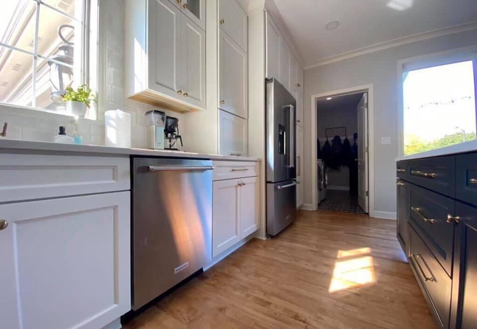 Warm Wood Floors Paired with White and Dark Grey (Iron Ore SW) cabinets