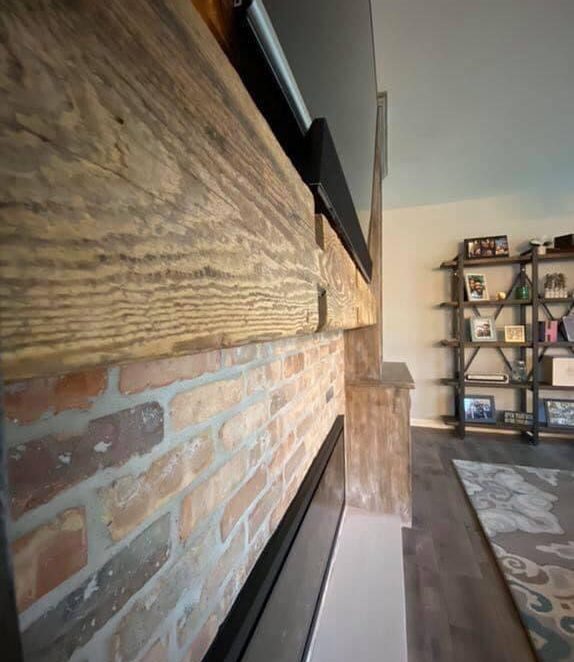 Vintage Brick Entrainment Wall Paired with Reclaimed Wood Mantle