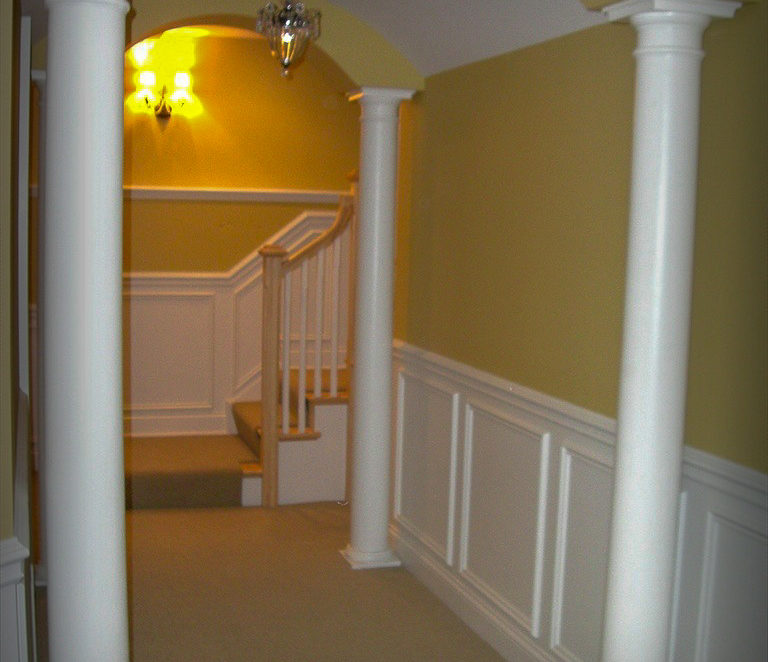 Archways with raised panels in Basement Hall